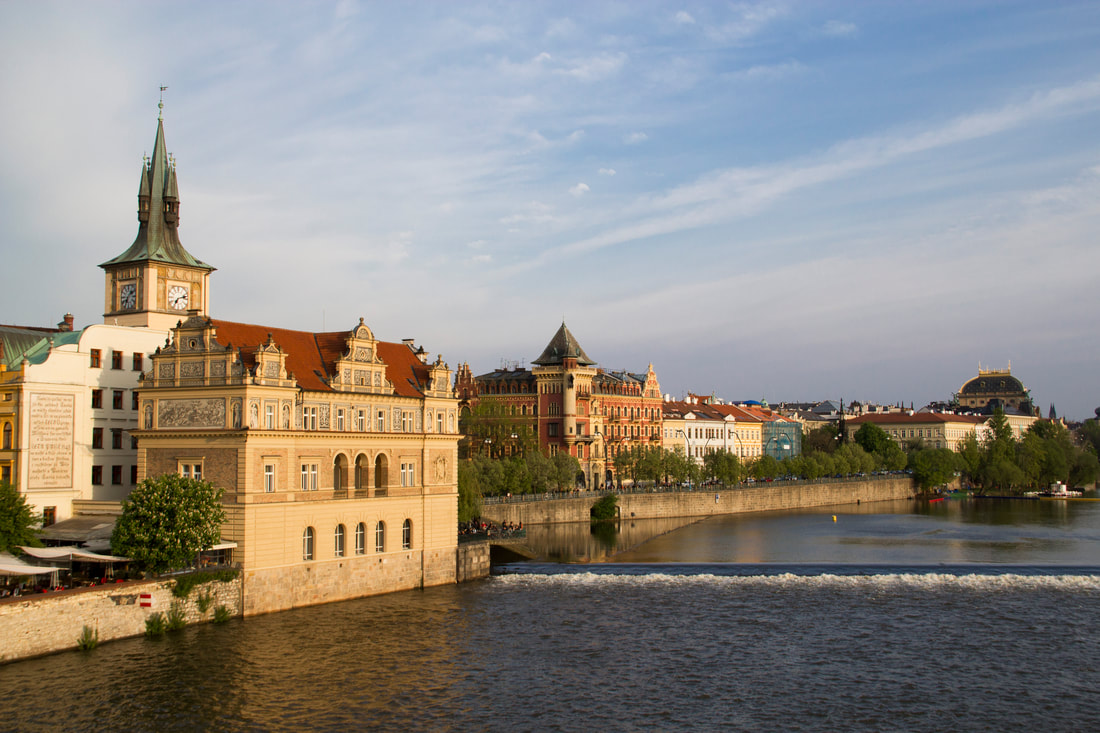 A view of the Vltava river in Prague before sunset.
